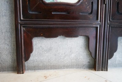 A Chinese wooden room divider with famille rose 'Romance of the Western Chamber' plaques, Republic