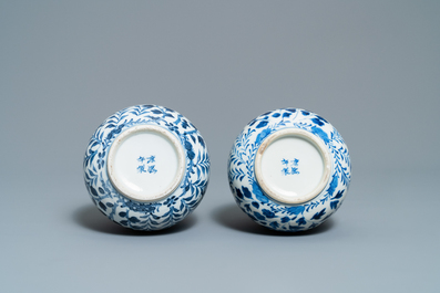 A pair of Chinese blue and white bottle vases with dragons, 19th C.