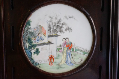 A Chinese wooden room divider with famille rose 'Romance of the Western Chamber' plaques, Republic