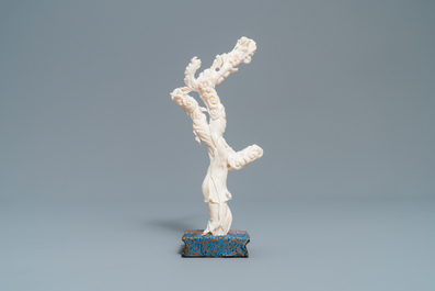 A Chinese carved white coral figure of a lady with fan, Republic