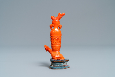 A Chinese carved red coral snuff bottle with a vase resting on a tortoise, Republic