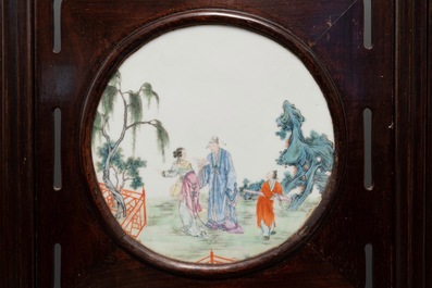 A Chinese wooden room divider with famille rose 'Romance of the Western Chamber' plaques, Republic