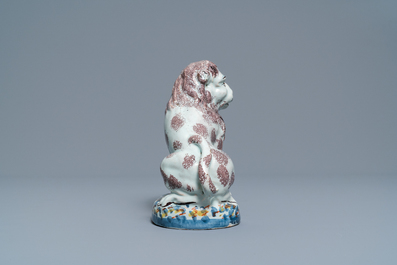 A polychrome Brussels or Lille faience model of a lion, late 18th C.