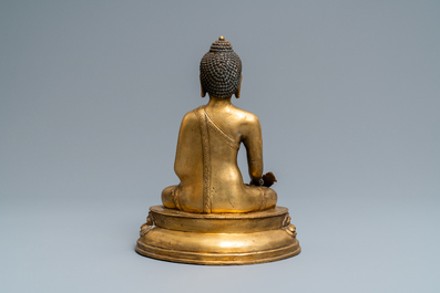 A Tibetan gilt bronze figure of Buddha, early 20th C.