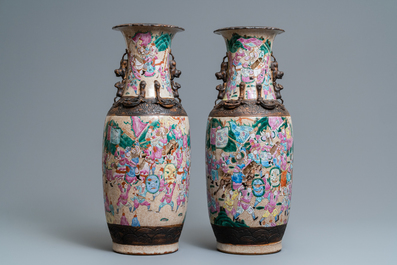 A pair of Chinese Nanking famille rose crackle-glazed 'warrior' vases, 19th C.