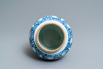Een Chinese blauw-witte vaas met florale panelen, Kangxi