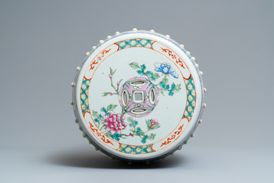 A Chinese famille rose garden seat with flowers among blossoms, 19th C.