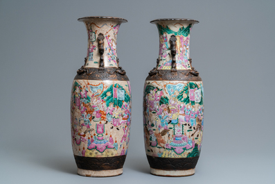 A pair of Chinese Nanking famille rose crackle-glazed 'warrior' vases, 19th C.