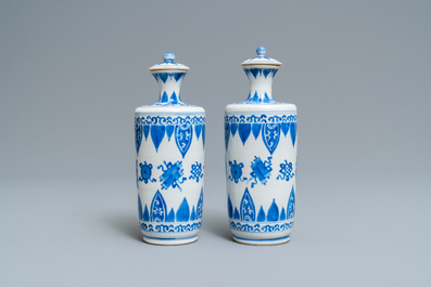 A pair of Chinese blue and white vases and covers, Kangxi