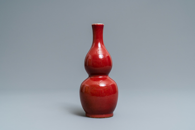 A Chinese monochrome sang-de-boeuf double gourd vase, Qianlong mark, 19/20th C.