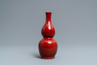 A Chinese monochrome sang-de-boeuf double gourd vase, Qianlong mark, 19/20th C.
