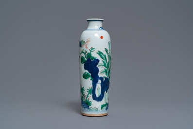 A Chinese wucai rouleau vase with figures in a landscape, Transitional period