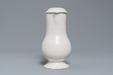 A white Delftware jug and cover, 18th C.