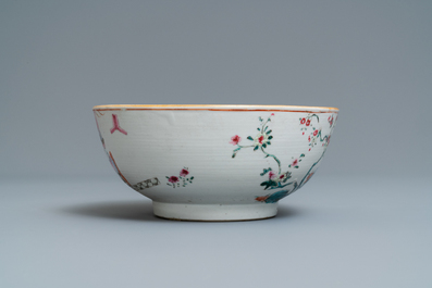 A Chinese famille rose bowl with figures in an interior, Yongzheng