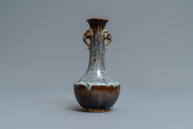 A Chinese flamb&eacute;-glazed vase with elephant head handles, 18/19th C.