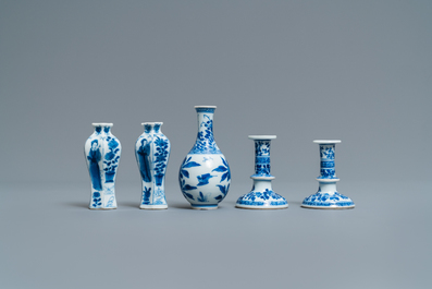 A pair of small Chinese blue and white candlesticks and three vases, Kangxi