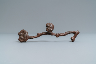 A Chinese cast iron brush rest in the shape of a lingzhi ruyi scepter, Ming