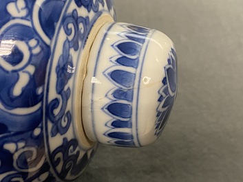 A pair of Chinese blue and white lidded jars with floral design, Kangxi