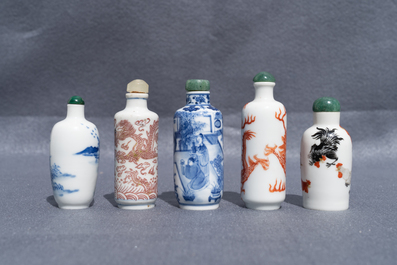 Five Chinese blue and white, iron- and copper-red snuff bottles, 19th C.