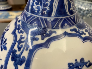 A Chinese blue and white bottle vase with floral design and antiquities, Kangxi