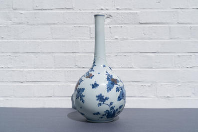A Chinese blue, white and copper-red 'peaches' bottle vase with inscription, Kangxi
