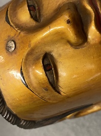 A Chinese gilt and laquered wooden figure of Buddha, 18/19th C.