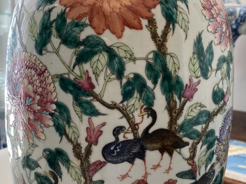 A pair of Chinese famille rose vases with birds among blossoms, 19th C.