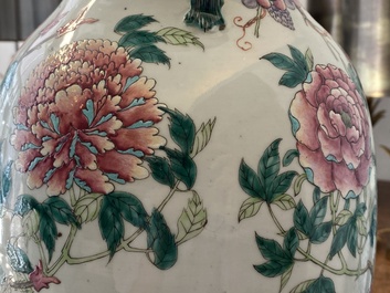 A pair of Chinese famille rose vases with birds among blossoms, 19th C.