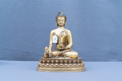 A Tibetan gilt bronze figure of Buddha, early 20th C.