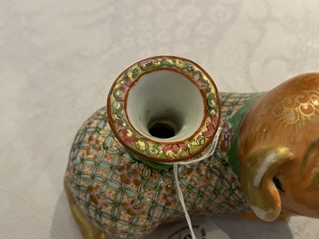 Three Chinese Canton famille rose models of dogs, two with candle holders, 19th C.