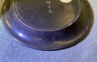 A pair of Chinese lac burgaut&eacute; saucer dishes, Kangxi