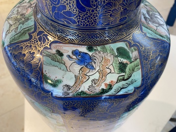A massive Chinese famille verte on powder blue-ground rouleau vase, Kangxi