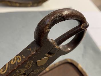 A Japanese gilt-lacquered 'kura' saddle with matching 'abumi' stirrups, Muromachi, 16th C.