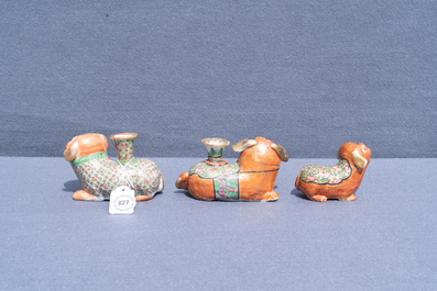 Three Chinese Canton famille rose models of dogs, two with candle holders, 19th C.