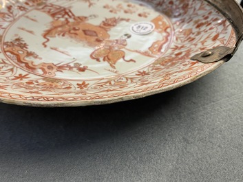 Three Chinese iron-red and gilt plates and a silver-mounted dish, Kangxi