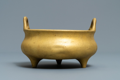 A Chinese gilt bronze tripod censer, Xuande mark, 19/20th C.