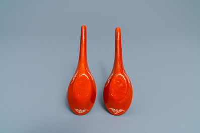 A pair of Chinese reverse-decorated iron red spoons, 19th C.