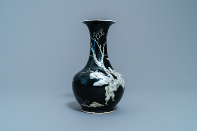 A Chinese black-ground grisaille and iron red vase and a snuff bottle, 18th C.