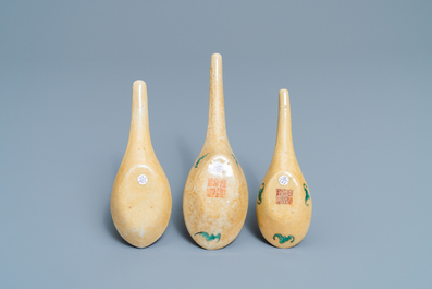 Three Chinese famille rose caf&eacute;-au-lait-ground spoons, Daoguang mark and of the period