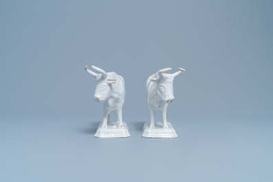 A pair of white Dutch Delftware cows on bases, 18th C.