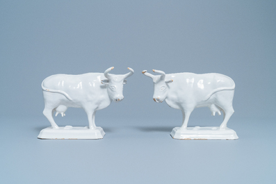 A pair of white Dutch Delftware cows on bases, 18th C.