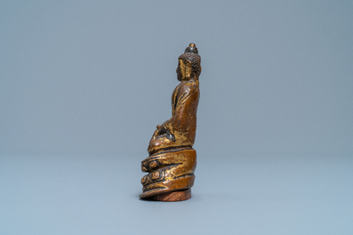 A Sino-Tibetan gilt bronze figure of Buddha Shakyamuni, Ming