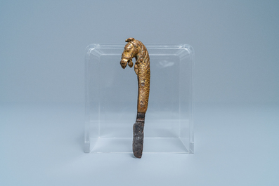 A Sino-Tibetan gilt bronze knife handle in the shape of a horse, Ming