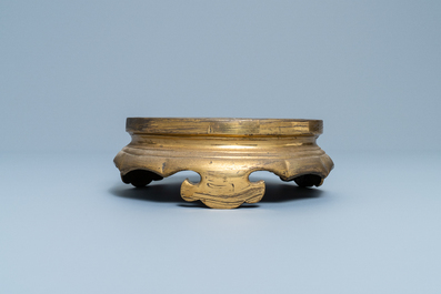 A Chinese gilt bronze stand, 19th C.