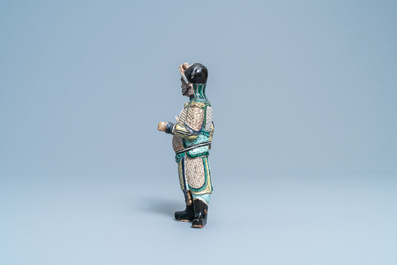 A Chinese verte biscuit figure of a Guandi, Kangxi