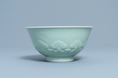 A Chinese moulded monochrome celadon bowl with incised design, Qianlong mark, 19th C.