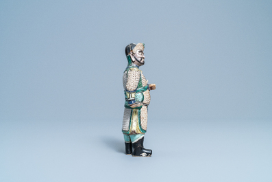 A Chinese verte biscuit figure of a Guandi, Kangxi