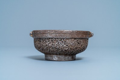 A reticulated polished steel bowl and cover with dragons, Tibet, 16/17th C.