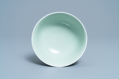 A Chinese moulded monochrome celadon bowl with incised design, Qianlong mark, 19th C.