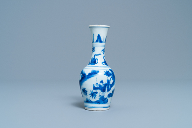 A Chinese blue and white bottle vase with figures in a landscape, Transitional period